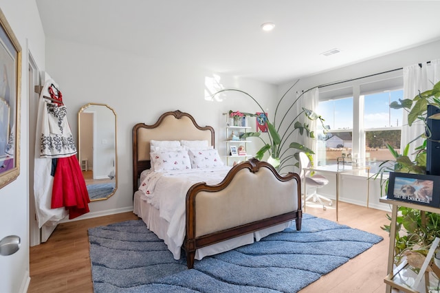 bedroom featuring light wood-type flooring