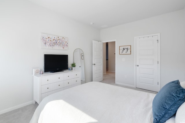 bedroom featuring light colored carpet