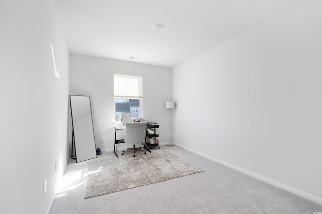 unfurnished office featuring light carpet