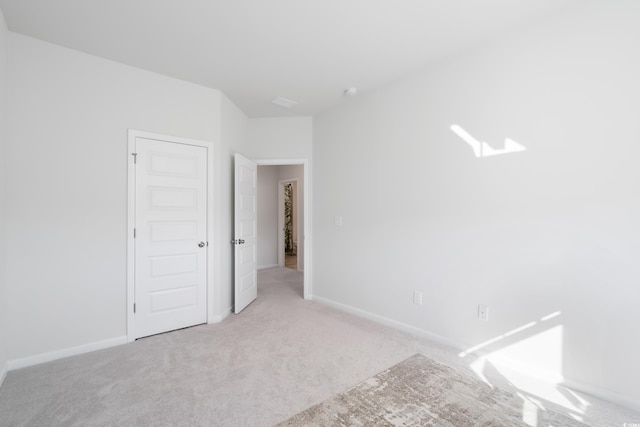 spare room with light colored carpet