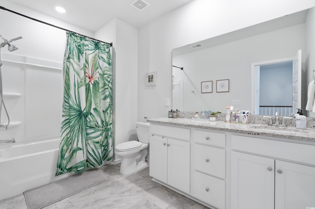 full bathroom featuring shower / bath combo, vanity, and toilet