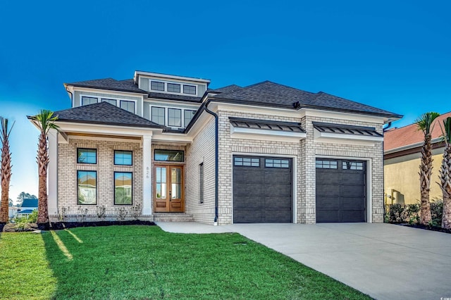 prairie-style house with a front lawn