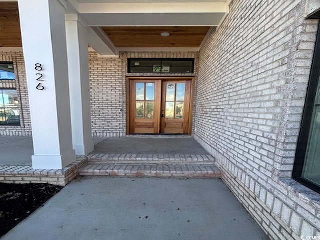 property entrance featuring french doors