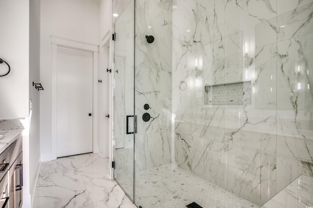 bathroom with vanity and a shower with door