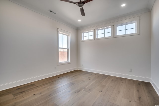 spare room with ceiling fan, light hardwood / wood-style flooring, and crown molding