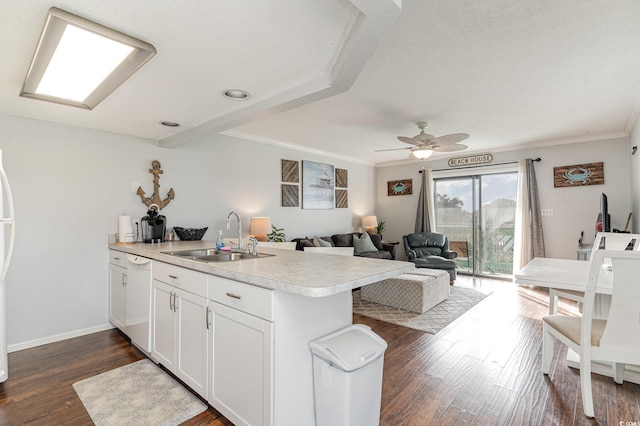 kitchen featuring crown molding, sink, white cabinets, and dark hardwood / wood-style floors