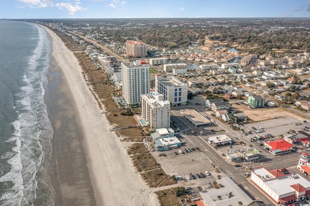 aerial view with a water view and a view of the beach