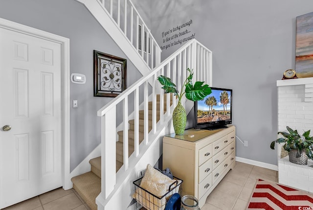 stairs featuring tile patterned floors