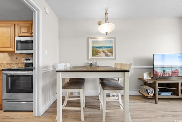 dining room featuring light hardwood / wood-style floors