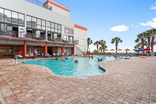 view of swimming pool with a patio area