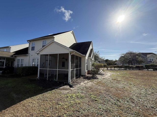 back of property featuring a sunroom