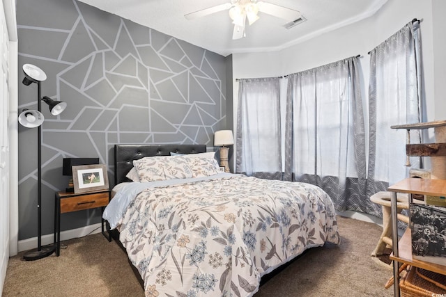 carpeted bedroom with a textured ceiling and ceiling fan