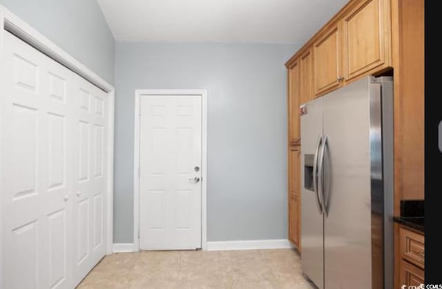 kitchen with stainless steel fridge with ice dispenser