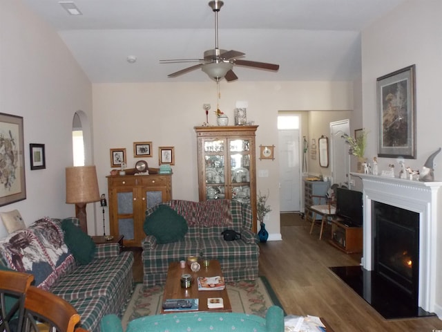 living room featuring ceiling fan and hardwood / wood-style floors