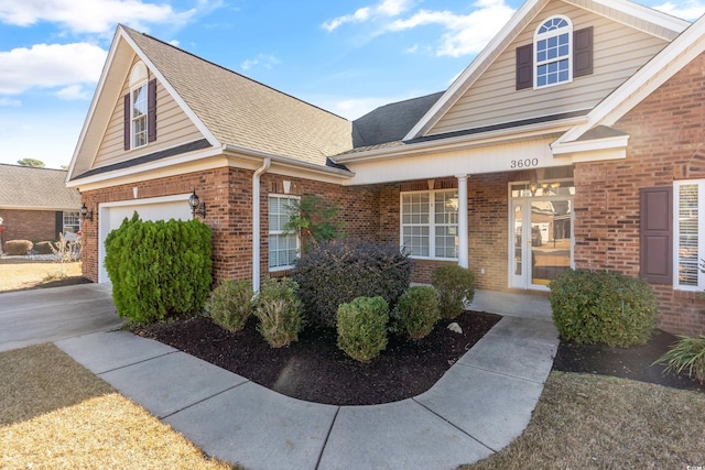 view of front of property featuring a porch and a garage