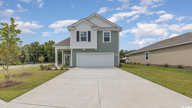 view of front of house featuring a garage and a front yard