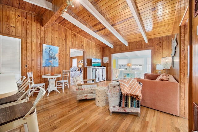 living room featuring vaulted ceiling with beams, wooden ceiling, track lighting, and hardwood / wood-style flooring