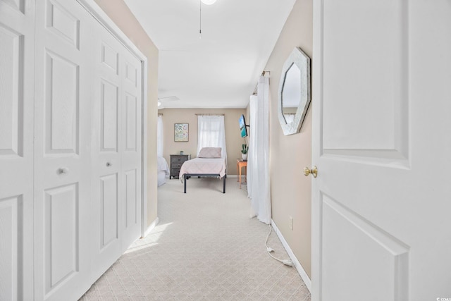 corridor with light colored carpet