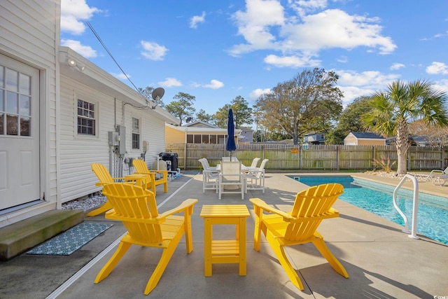 view of patio with a fenced in pool