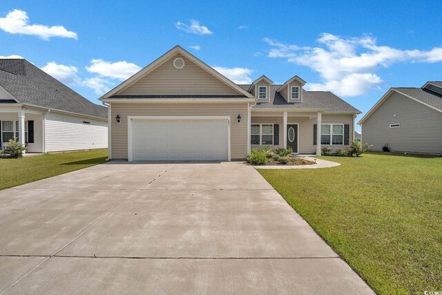 view of front of home with a front lawn and a garage