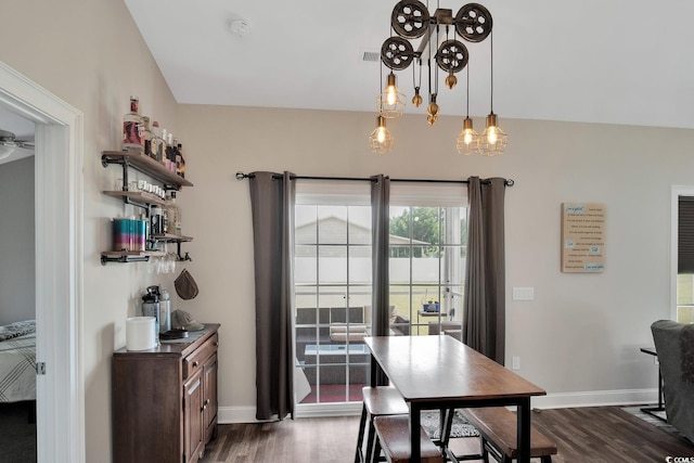 dining room featuring dark hardwood / wood-style floors and lofted ceiling