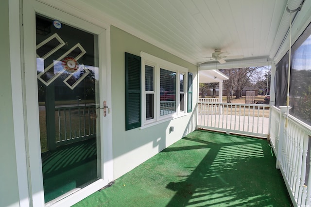 exterior space featuring ceiling fan and wooden ceiling