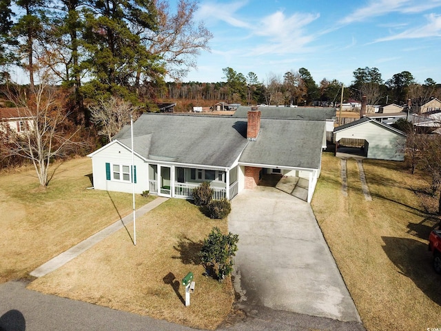 ranch-style house with a porch and a front yard