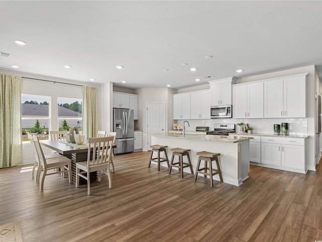 kitchen featuring white cabinets, dark hardwood / wood-style floors, and appliances with stainless steel finishes