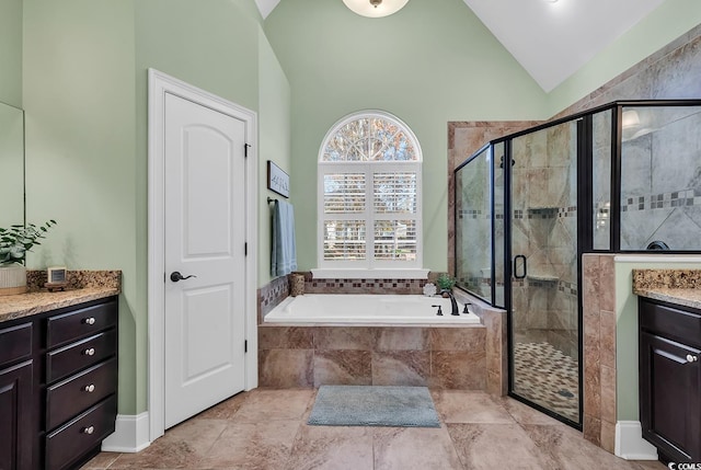 bathroom with vanity, separate shower and tub, and high vaulted ceiling