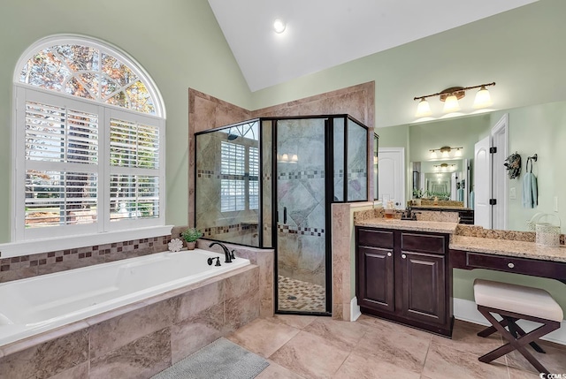 bathroom featuring tile patterned floors, vanity, lofted ceiling, and shower with separate bathtub