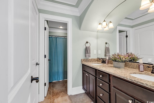 bathroom featuring tile patterned flooring, vanity, and ornamental molding