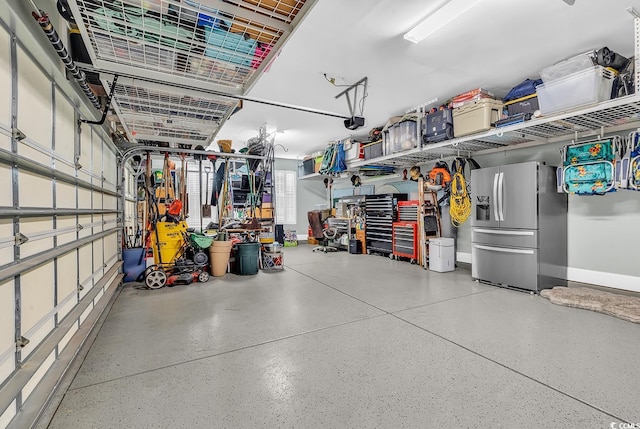 garage with stainless steel fridge