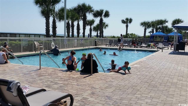 view of swimming pool with a patio area