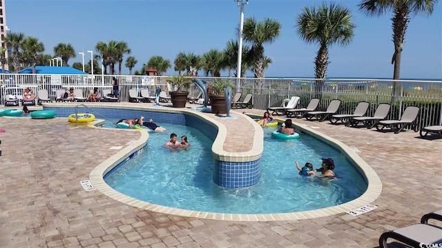 view of pool featuring a patio