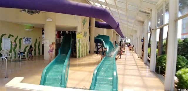 view of pool featuring a playground