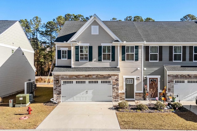 view of front of house featuring a front yard and a garage