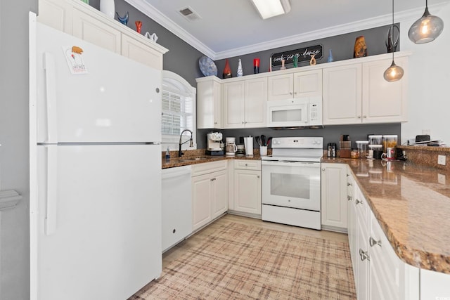 kitchen with pendant lighting, white appliances, white cabinets, sink, and ornamental molding