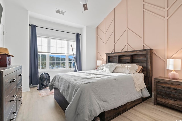 bedroom featuring light hardwood / wood-style flooring and ceiling fan