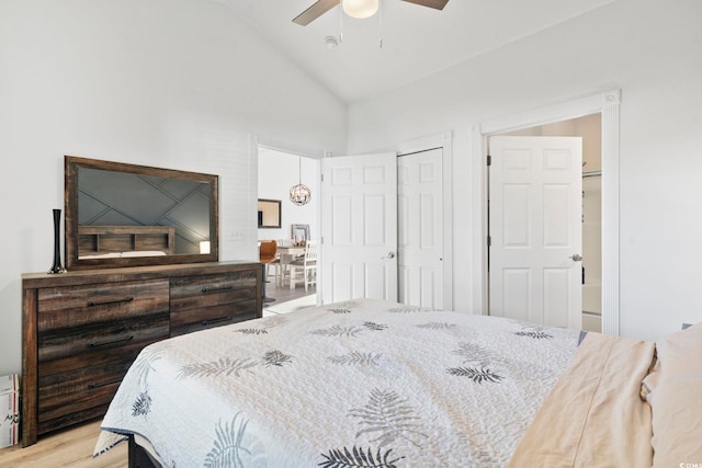 bedroom with ceiling fan, high vaulted ceiling, and light hardwood / wood-style flooring