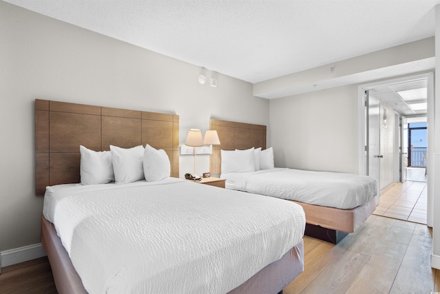 bedroom featuring light wood-type flooring