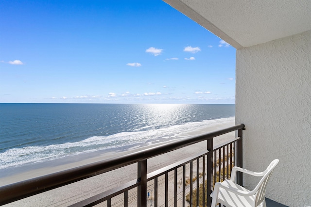 balcony featuring a water view