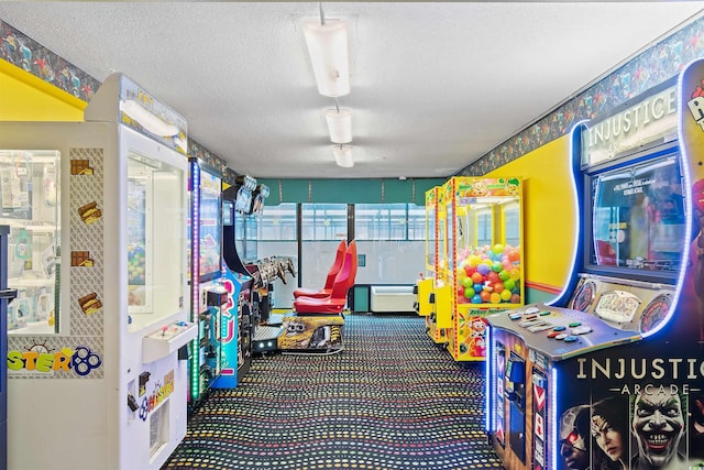 rec room featuring carpet and a textured ceiling