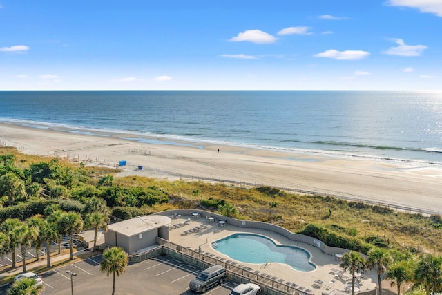 drone / aerial view featuring a view of the beach and a water view