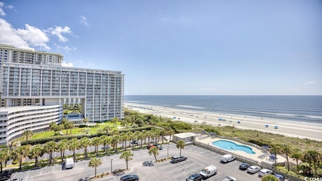 bird's eye view featuring a view of the beach and a water view