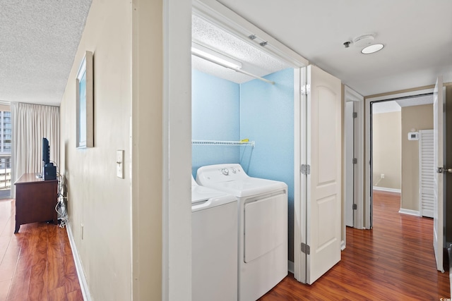 9820 Queensway Blvd Unit 903, Myrtle Beach, SC 29572 - laundry room with wood finished floors, independent washer and dryer, and a textured ceiling
