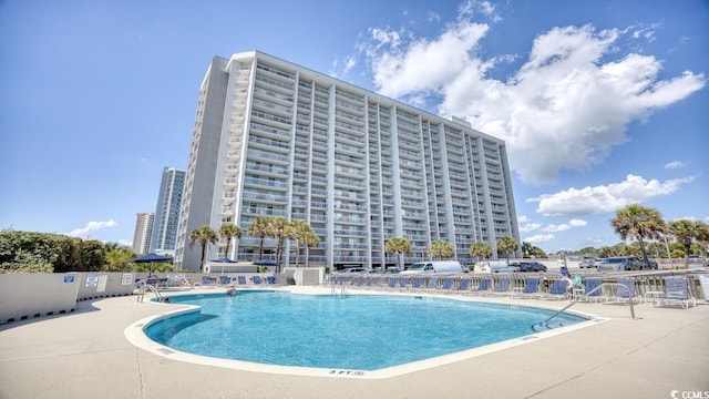 view of swimming pool featuring a patio area