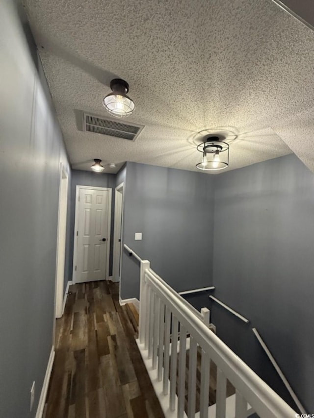 corridor featuring dark hardwood / wood-style floors