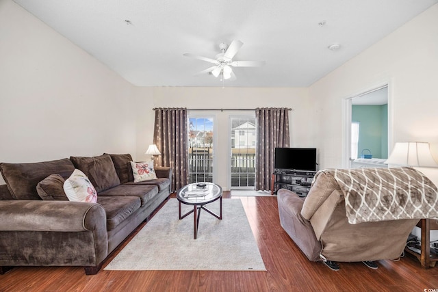 living room with ceiling fan and wood-type flooring