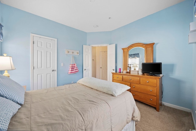 bedroom with light colored carpet