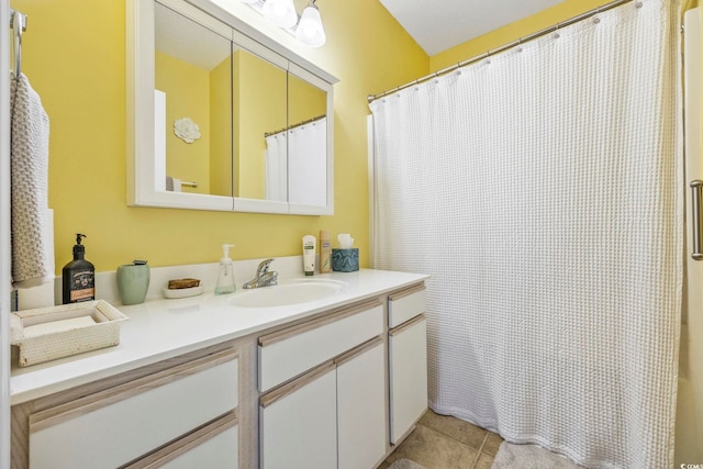 bathroom with tile patterned flooring and vanity